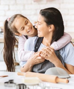 Daughter hugging mother